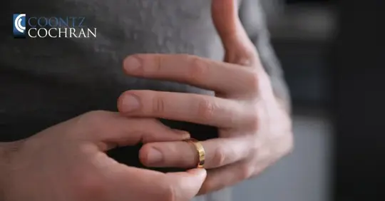 person holding a wedding ring